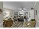 Bright living room with hardwood floors, neutral paint, ceiling fan and large windows at 407 15Th Ave. S, North Myrtle Beach, SC 29582