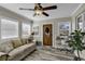 Comfortable living room with a decorative front door, couch, and a well-lit workspace at 407 15Th Ave. S, North Myrtle Beach, SC 29582