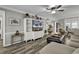 Bright living room with hardwood floors, neutral paint, ceiling fan and open concept access to kitchen at 407 15Th Ave. S, North Myrtle Beach, SC 29582