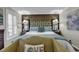 Beautiful primary bedroom featuring a decorative headboard, soft bedding, and lamps at 407 15Th Ave. S, North Myrtle Beach, SC 29582