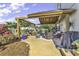 Outdoor patio with ample seating, a ceiling fan, garden views, and grilling space, perfect for entertaining friends and Gathering at 407 15Th Ave. S, North Myrtle Beach, SC 29582