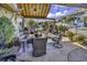 Outdoor patio featuring a ceiling fan, comfortable seating, lush landscaping, perfect for relaxing and entertaining guests at 407 15Th Ave. S, North Myrtle Beach, SC 29582