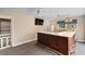 A recreation room with a wet bar, TV, mini fridge, sink, window, and ceiling fan at 4084 Hagwood Circle, Conway, SC 29526