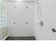 Bathroom shower with white tile, glass block and mounted shower head at 4084 Hagwood Circle, Conway, SC 29526
