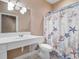 Bathroom with a single sink vanity, toilet, and tub with shower featuring a nautical curtain at 4084 Hagwood Circle, Conway, SC 29526