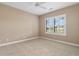 Bedroom with a large window and bright shutters with neutral walls and carpets at 4084 Hagwood Circle, Conway, SC 29526