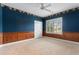 Bedroom featuring plush carpeting, ceiling fan, window with shutters, and wood trim at 4084 Hagwood Circle, Conway, SC 29526