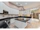 Spacious kitchen with white cabinetry, granite countertops, and stainless steel appliances for modern convenience at 4084 Hagwood Circle, Conway, SC 29526