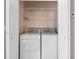Laundry room featuring a full washer and dryer, wire shelving, and storage space at 4084 Hagwood Circle, Conway, SC 29526