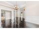 Grand living area with tiled floor, columns, and chandeliers, offering a luxurious and open space at 4084 Hagwood Circle, Conway, SC 29526