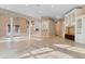 Open-concept living area featuring tile floors, stylish columns, and a built-in bar area at 4084 Hagwood Circle, Conway, SC 29526
