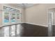 Bright living room with tile flooring and double doors leading to the backyard pool and patio area at 4084 Hagwood Circle, Conway, SC 29526