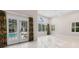 Bright living room with large windows, French doors, and view of swimming pool at 4084 Hagwood Circle, Conway, SC 29526