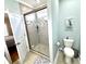 Bathroom with walk-in shower featuring gray tile and patterned floors at 412 29Th Ave. N, North Myrtle Beach, SC 29582