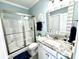 Bathroom featuring a glass shower, granite vanity and a modern sink at 412 29Th Ave. N, North Myrtle Beach, SC 29582