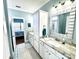 Inviting bathroom featuring neutral tile flooring, granite counters and white cabinets at 412 29Th Ave. N, North Myrtle Beach, SC 29582