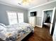 Comfortable bedroom featuring hardwood floors, neutral paint and an exterior view at 412 29Th Ave. N, North Myrtle Beach, SC 29582