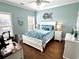Bedroom featuring a white framed bed, white desk and blue decor at 412 29Th Ave. N, North Myrtle Beach, SC 29582
