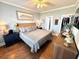 Comfortable bedroom with hardwood floors, stylish decor, and a walk-in closet at 412 29Th Ave. N, North Myrtle Beach, SC 29582