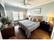 Bright bedroom with a ceiling fan, hardwood floors, and natural light at 412 29Th Ave. N, North Myrtle Beach, SC 29582