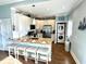 Bright kitchen with white cabinets, a breakfast bar, and stainless steel appliances at 412 29Th Ave. N, North Myrtle Beach, SC 29582