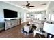 Bright living room with a large sectional couch, decorative rug, and a ceiling fan at 412 29Th Ave. N, North Myrtle Beach, SC 29582