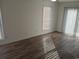 Bedroom offers natural light with wood-look floors, and access to the outdoors at 418 C Tree Top Ct. # 0, Myrtle Beach, SC 29588