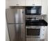 Well-appointed kitchen features stainless appliances, white cabinets, and a stylish brick backsplash at 418 C Tree Top Ct. # 0, Myrtle Beach, SC 29588