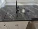 Modern kitchen sink in an island with elegant dark granite countertops and stainless steel appliances at 418 C Tree Top Ct. # 0, Myrtle Beach, SC 29588