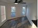 Bright living area with ample natural light, features sleek flooring and a modern ceiling fan at 418 C Tree Top Ct. # 0, Myrtle Beach, SC 29588