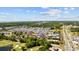 High-angle aerial view of a community with a marina, golf course, highway, and waterfront at 4200 Coquina Harbour Dr. # H5, Little River, SC 29566