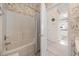 Cozy bathroom including a shower-tub combination and adjacent open doorway to the toilet and vanity at 4200 Coquina Harbour Dr. # H5, Little River, SC 29566