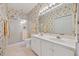 Bathroom featuring double sink vanity, walk-in shower, and decorative wall paper at 4200 Coquina Harbour Dr. # H5, Little River, SC 29566