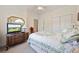 Comfortable bedroom with neutral carpets, closet storage space, and a flat screen TV at 4200 Coquina Harbour Dr. # H5, Little River, SC 29566