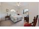 Cozy bedroom with a ceiling fan, large window for natural light and a comfortable bed at 4200 Coquina Harbour Dr. # H5, Little River, SC 29566