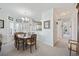 Open-concept dining area adjacent to the kitchen, with a chandelier and large windows at 4200 Coquina Harbour Dr. # H5, Little River, SC 29566