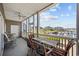 Relaxing screened patio with comfortable seating and a view of the marina at 4200 Coquina Harbour Dr. # H5, Little River, SC 29566
