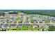 Aerial view of a community featuring manicured lawns, mature trees, and a pond at 4200 Woodcliffe Dr., Conway, SC 29526