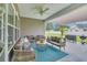 Covered back porch with outdoor seating area and ceiling fan at 4200 Woodcliffe Dr., Conway, SC 29526