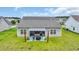 Aerial view of a home backyard with covered patio, barbecue and an expansive lawn at 4200 Woodcliffe Dr., Conway, SC 29526