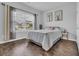 Cozy bedroom featuring hardwood floors, a comfortable bed, and bright natural light at 4200 Woodcliffe Dr., Conway, SC 29526