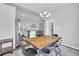 Open dining area with stylish chandelier adjoining the kitchen with stainless steel appliances and breakfast bar at 4200 Woodcliffe Dr., Conway, SC 29526