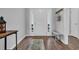 Bright entryway with hardwood floors, a bench, and hooks for a tidy and inviting space at 4200 Woodcliffe Dr., Conway, SC 29526