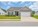 Inviting single-Gathering home with a two-car garage and a beautifully landscaped front yard at 4200 Woodcliffe Dr., Conway, SC 29526