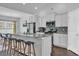 Modern kitchen with granite countertops, stainless steel appliances, and a center island with bar stools at 4200 Woodcliffe Dr., Conway, SC 29526