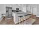 Bright kitchen with stainless steel appliances, granite counters, backsplash, and four-seat breakfast bar at 4200 Woodcliffe Dr., Conway, SC 29526