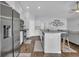 Bright, open kitchen with white cabinets, stainless steel appliances, and a large island for entertaining at 4200 Woodcliffe Dr., Conway, SC 29526