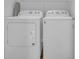 Laundry room with white washer and dryer units and shelving for storage at 4200 Woodcliffe Dr., Conway, SC 29526