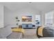 Open concept living room with hardwood floors and a TV displaying a beach scene at 4200 Woodcliffe Dr., Conway, SC 29526