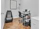 Office space with desk, ergonomic chair, storage unit, and wood floors at 4200 Woodcliffe Dr., Conway, SC 29526